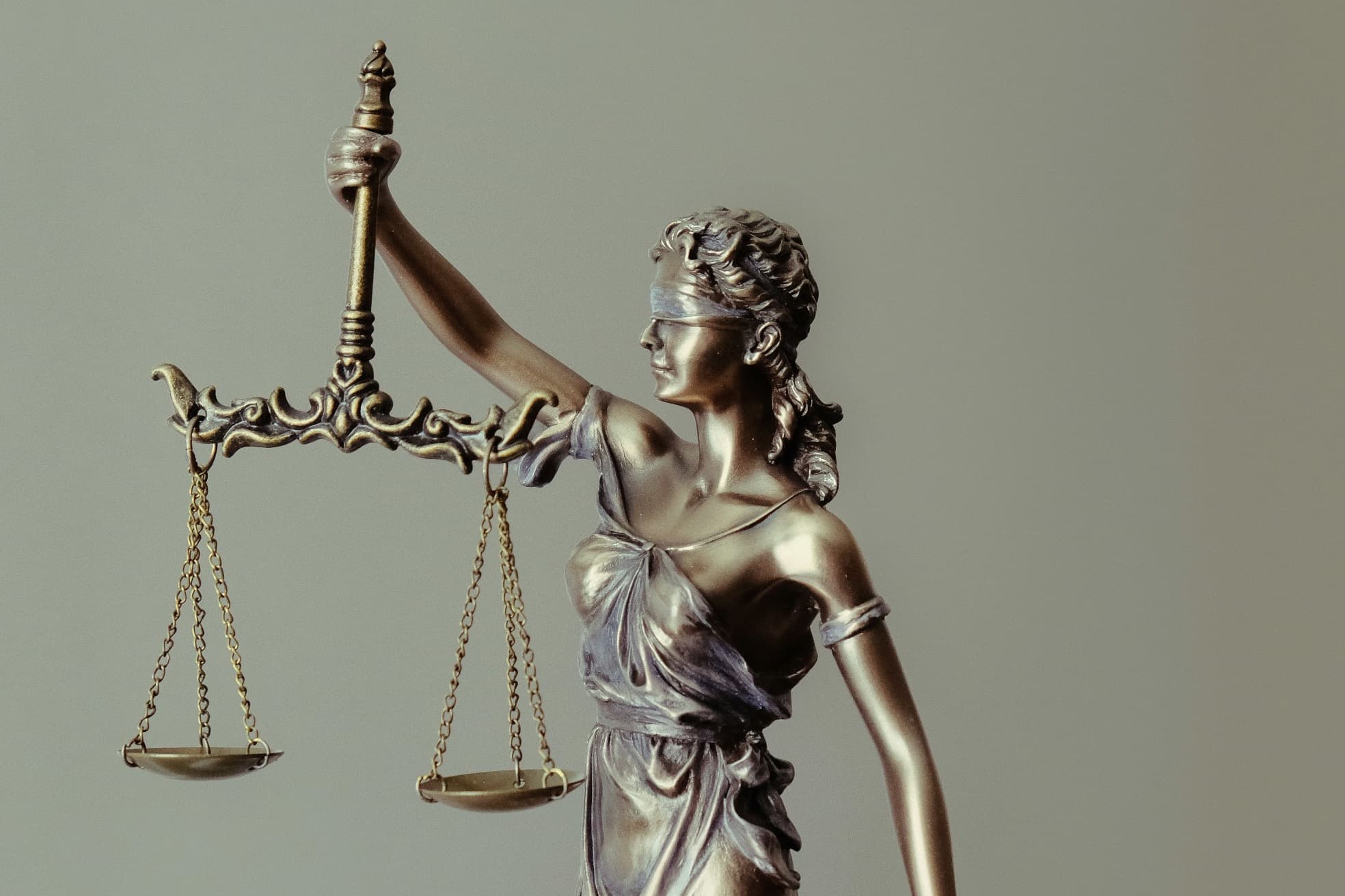 A statue of Lady Justice holding the scales of justice.